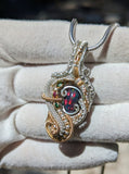 Black Ethiopian Opal, Sapphire, and Tsavorite Garnet Pendant