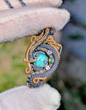 Ethiopian Opal, Tanzanite, and Emerald Pendant