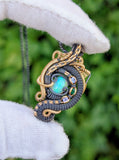 Ethiopian Opal, Tanzanite, and Emerald Pendant