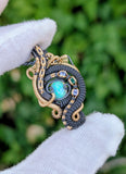 Ethiopian Opal, Tanzanite, and Emerald Pendant