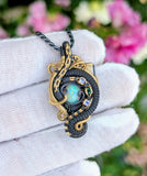 Ethiopian Opal, Tanzanite, and Emerald Pendant