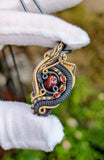 Black Ethiopian Opal and Garnet Pendant