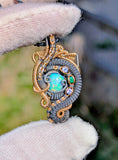 Ethiopian Opal, Tanzanite, and Emerald Pendant