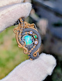 Ethiopian Opal, Tanzanite, and Emerald Pendant